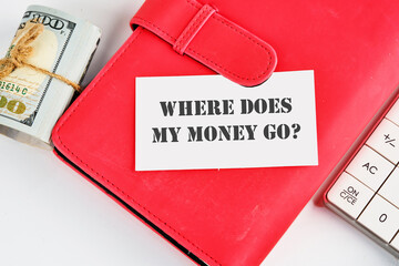 Question WHERE DOES MY MONEY GO on a business card on a business notebook near money and a...