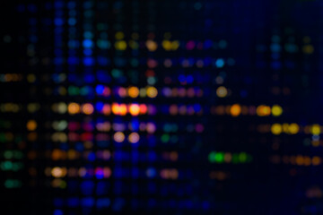 Close up blurred and softy bokeh of multicolor from LED lighting on stage. Background for dramatic or mystery or Sci-fi concept.