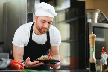 Smiling chef in his kitchen