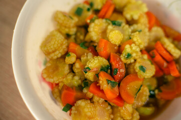 sauté carrots and baby corn