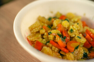 sauté carrots and baby corn