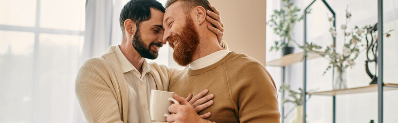 Two men wrapped in a warm hug inside a cozy living room, showcasing love and togetherness.