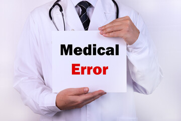 Doctor holding a card with Medical Error medical concept