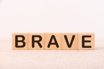 BRAVE word made with building blocks on a light background