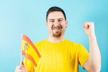 Man holding Spain flag cheering in support of national football team