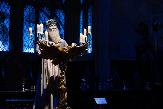 JAPAN - NOV 13, 2023: Dumbledore wizard statue illuminate candlelight stand in gothic style room with arch window magical theme in The Making of Harry Potter, Warner Bros Studio Tour, Tokyo, Japan