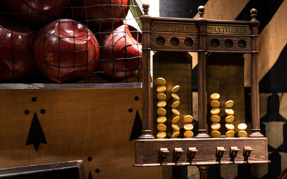 JAPAN - NOV 13, 2023: A wooden house point scoreboard for Gryffindor and Slytherin with tokens and red balls in a net at The Making of Harry Potter, Warner Bros Studio Tour Tokyo, Japan