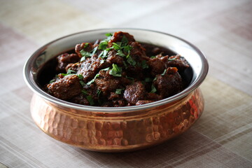Indian meat dish served in transitional pot
