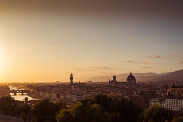 Dark silhouettes of Firenze city landmarks at sunset and bridges over the Arno river, ITALY