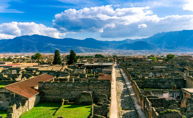panoramic view of Pompeii ruins in Italy near Naples uotdoor under blue cloudy sky. Landscape of...