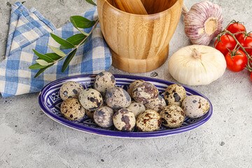 Raw quail eggs in the bowl