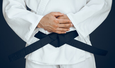 Hands, karate and black belt in studio for master, exercise and training for taekwondo greeting....
