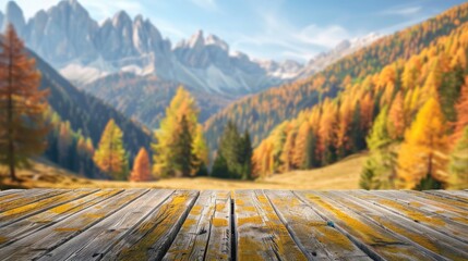 Wooden table top on blurred background of autumn color landscape in dolomites - for display your products