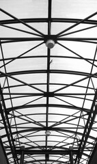 Vertical black and whitestructure of steel for building construction on sky background.