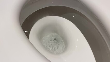 Clean toilet flush water flow
