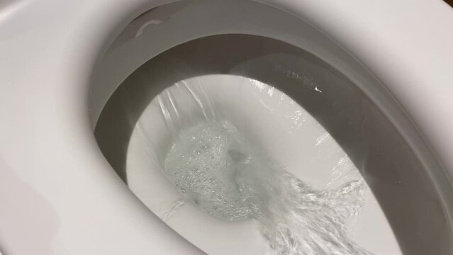 Clean toilet flush water flow
