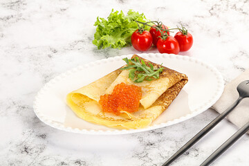 Russian pancake with red caviar