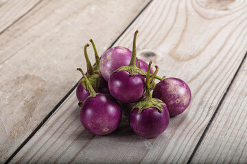 Raw small purple asian baby eggplant