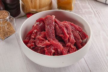 Raw beef meat - sliced strips