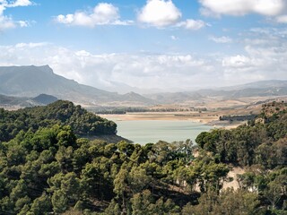 Fototapeta premium The Penarrubia dam lake water reservoir on the Guadalhorce river for producing electricity, green renewable energy, in Andalusia