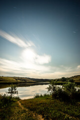 Obraz premium Landscape with beautiful sky and forest trees. Green woods and trees at summer 
