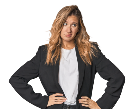 Young businesswoman in a suit confused, feels doubtful and unsure.