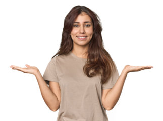 Middle Eastern woman in studio makes scale with arms, feels happy and confident.