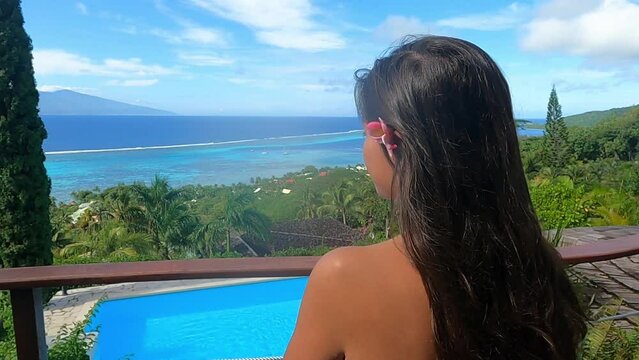 woman relaxing in a towel in front of a magnificent view in polynesia 
