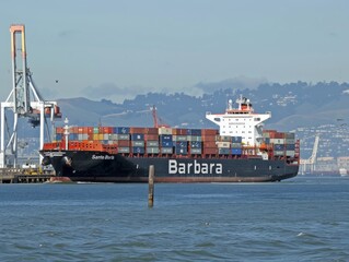 Maneuvering into Port: Hamburg Sud Ship 'Santa Barbara' Arrives at Oakland Container Shipyard in Ala