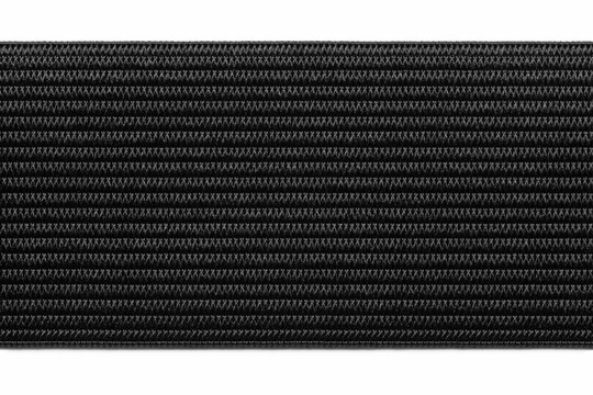 The elastic band is wide for household use. Background, black texture, close-up.