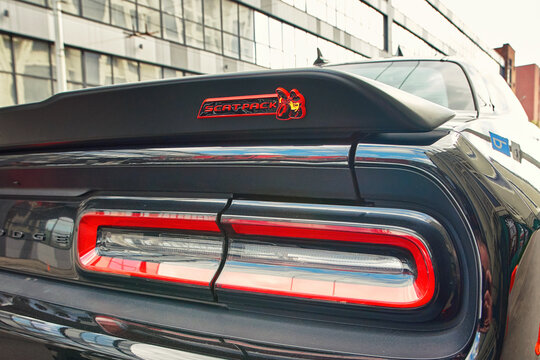 Minsk, Belarus. Apr 27, 2024. Dodge Challenger tail light closeup, scat pack sticker on the rear side of car body. Dodge Challenger rearlights, back view.