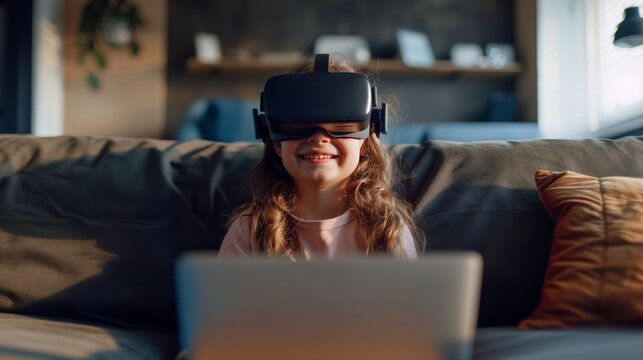 Happy 10-year-old girl sit on sofa with vr headset and laptop, canon r6 mark ii 35mm lens