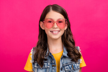 Portrait of cheerful kid girl toothy smiling wear sunglass isolated bright color background