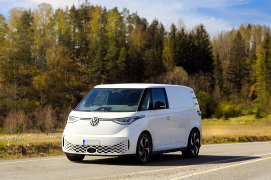 White Volkswagen ID. Buzz Battery Electric Van Year 2023 on the Road.