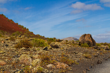 Haking trail around Montana Colorada.   Huge volcanic bomb. Lanzarote island, Canary islands, Spain, Europe