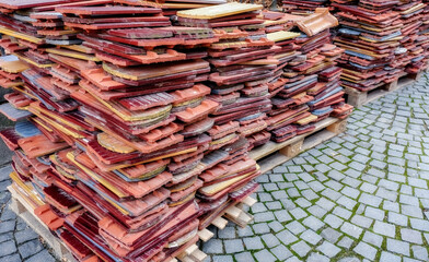 A pile of neatly stacked used tiles
