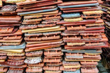 A pile of neatly stacked used tiles