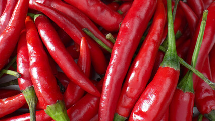 Explore the mesmerizing world of red chili peppers in macro. Witness the delicate textures, vibrant hues, and intricate patterns that make these peppers a botanical marvel. 
