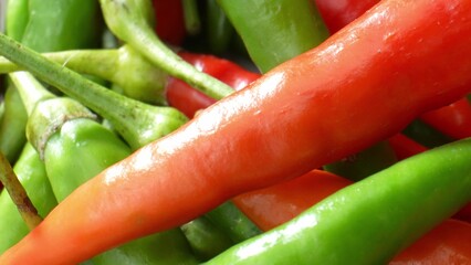 Spicy Splendor: Dive into the world of colorful chili peppers as they reveal their intricate textures and captivating colors in stunning macro. Spicy and heat concept. 
