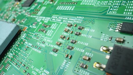 Dive into the captivating microcosm of a Printed Circuit Board (PCB) as the camera zooms in,...