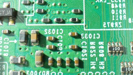 Explore the intricate world of electronics with a captivating macro of a Printed Circuit Board (PCB), unveiling its intricate pathways. Electronic devices concept.
