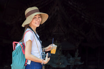 Happy Asian woman tourist enjoy travel in summer season with beverage cool iced juice drinks.
