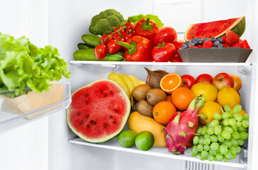refrigerator full of fresh vegetables and fruits