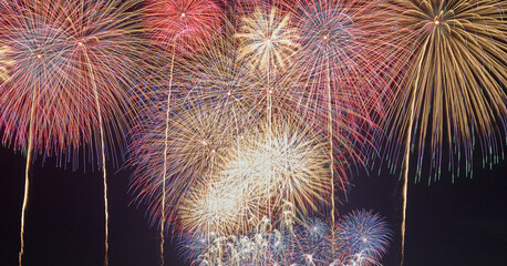 Summer fireworks in Japan, brilliant and colorful on a black background	
