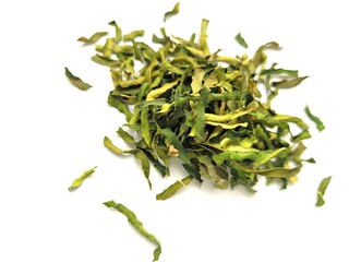 Dried pieces of kaffir leaves on a bright background.