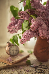 Still-life. A photo of a bouquet of lilacs on the table.