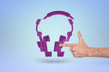 Obraz premium Floating purple headphones with human touch