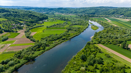 Dunajec river bend in picturesque landscape of Lesser Poland near Tarnow,. Aeral drone view.