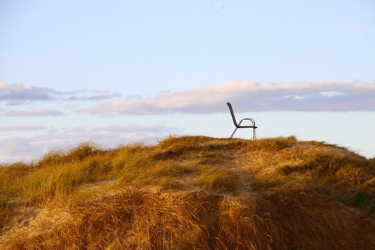 Empty chair on top of a hill