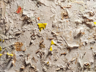 Tattered Posters on a Weathered Urban Wall. Layers of torn posters creating a textured collage. Background, texture, pattern, frame, copy space